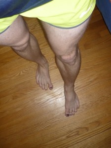 My running colours. Blue/black top, yellow shorts, white legs, black toenails.